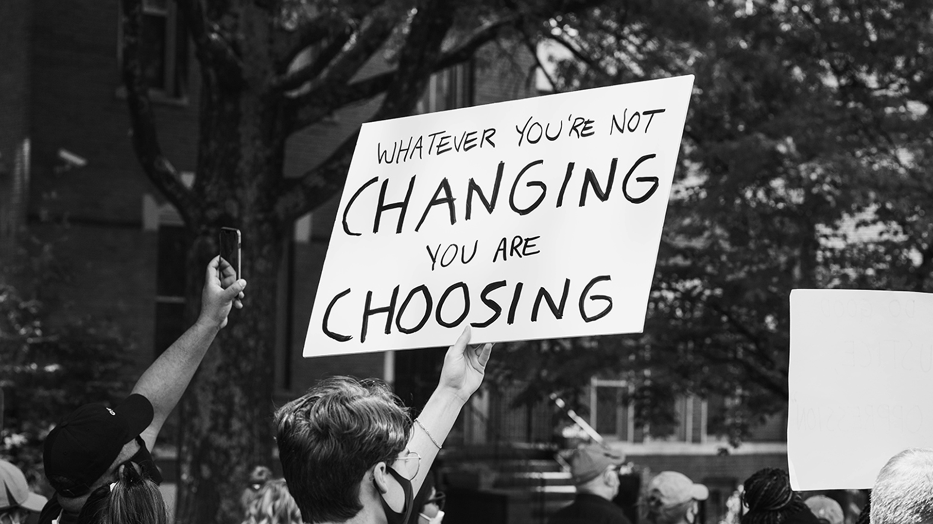 People holding signs at a protest