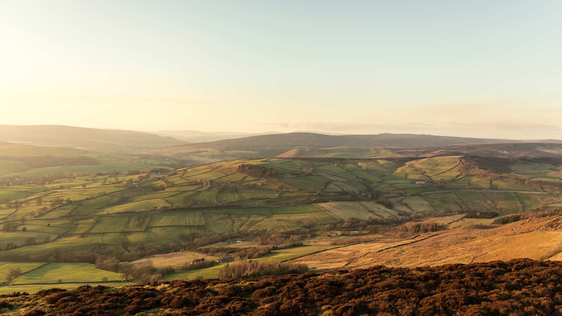 Brown and green mountains under white sky during daytime