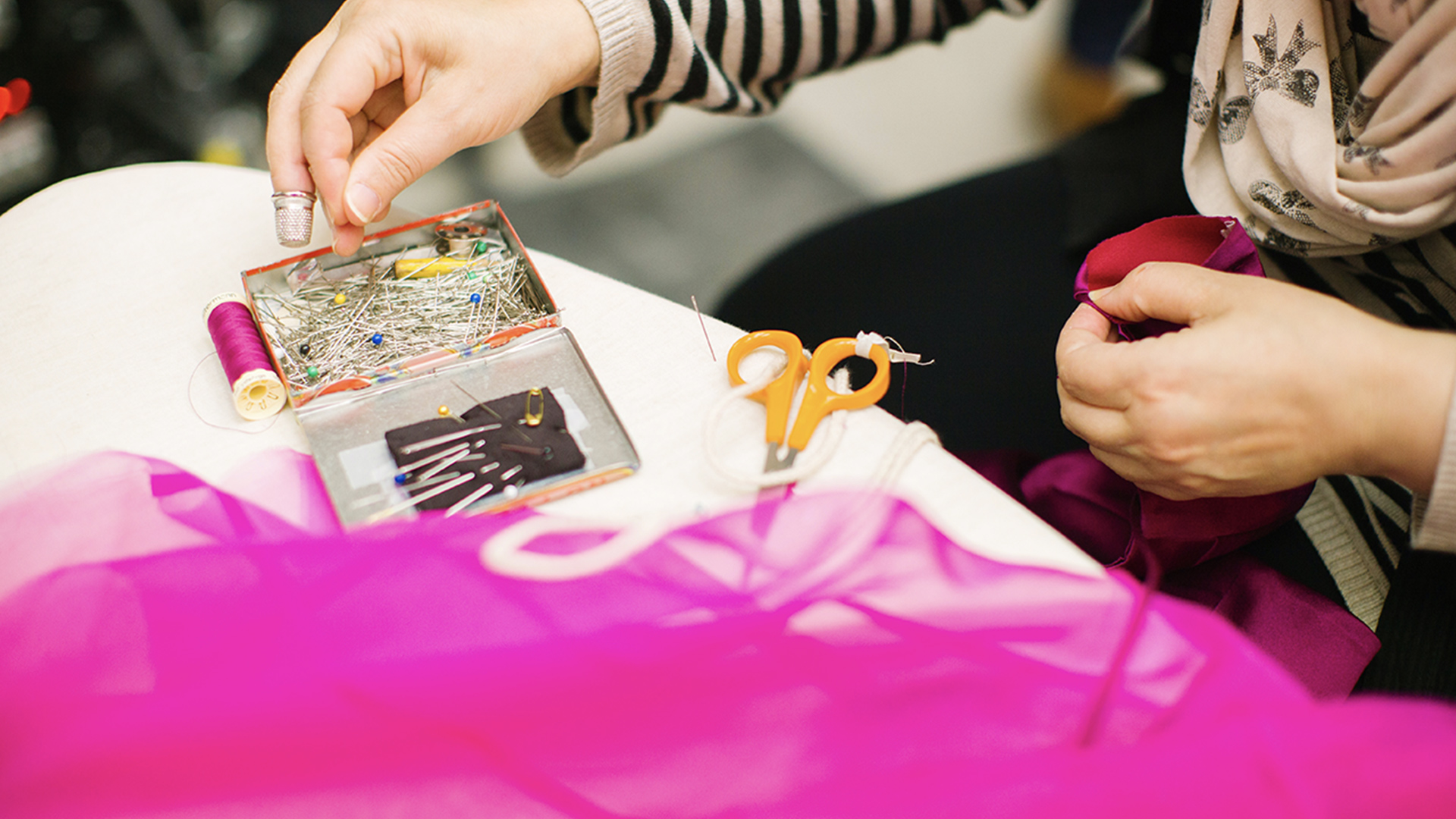 Designer making a pink outfit