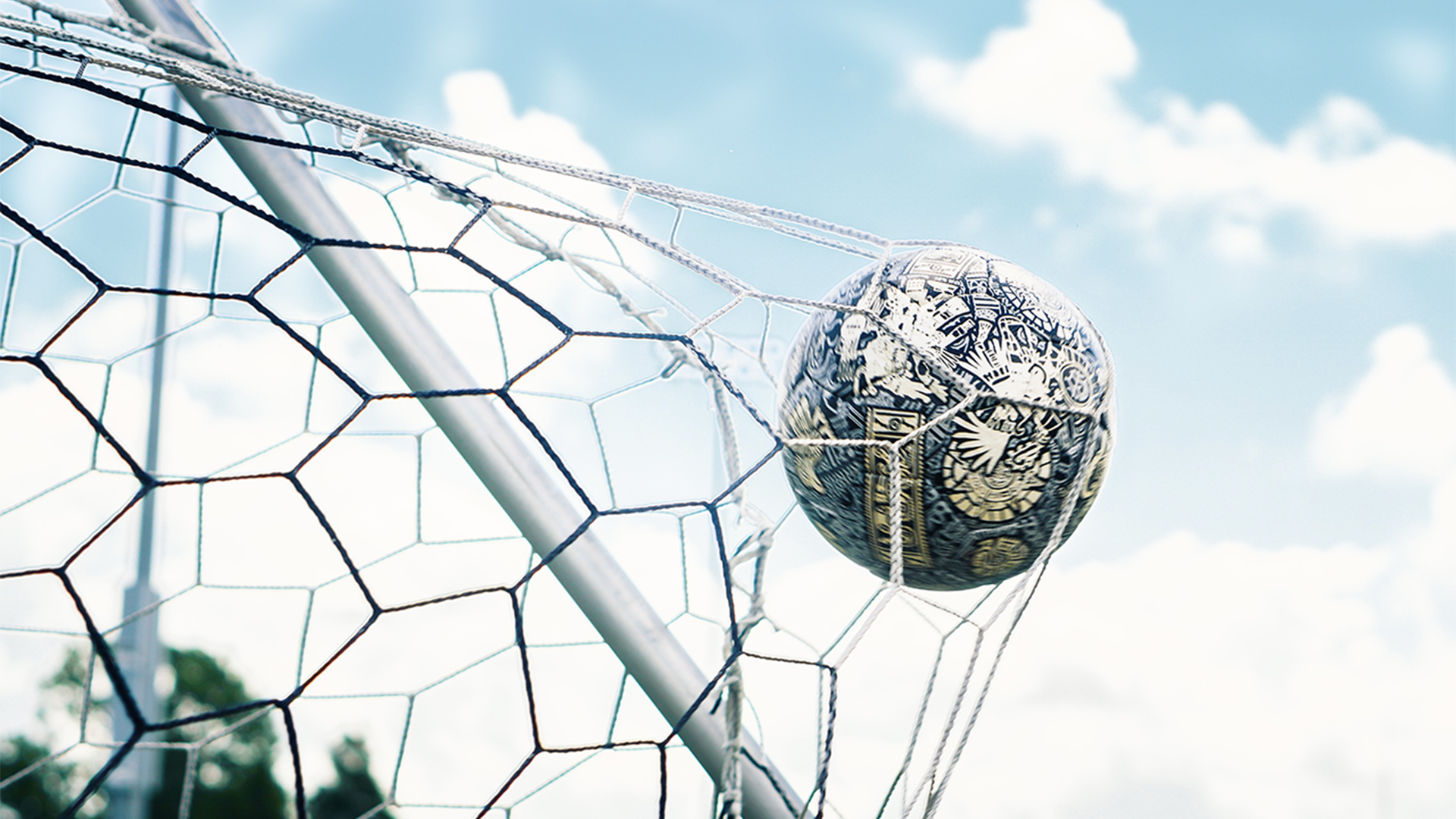 A ball hitting the back of a football net
