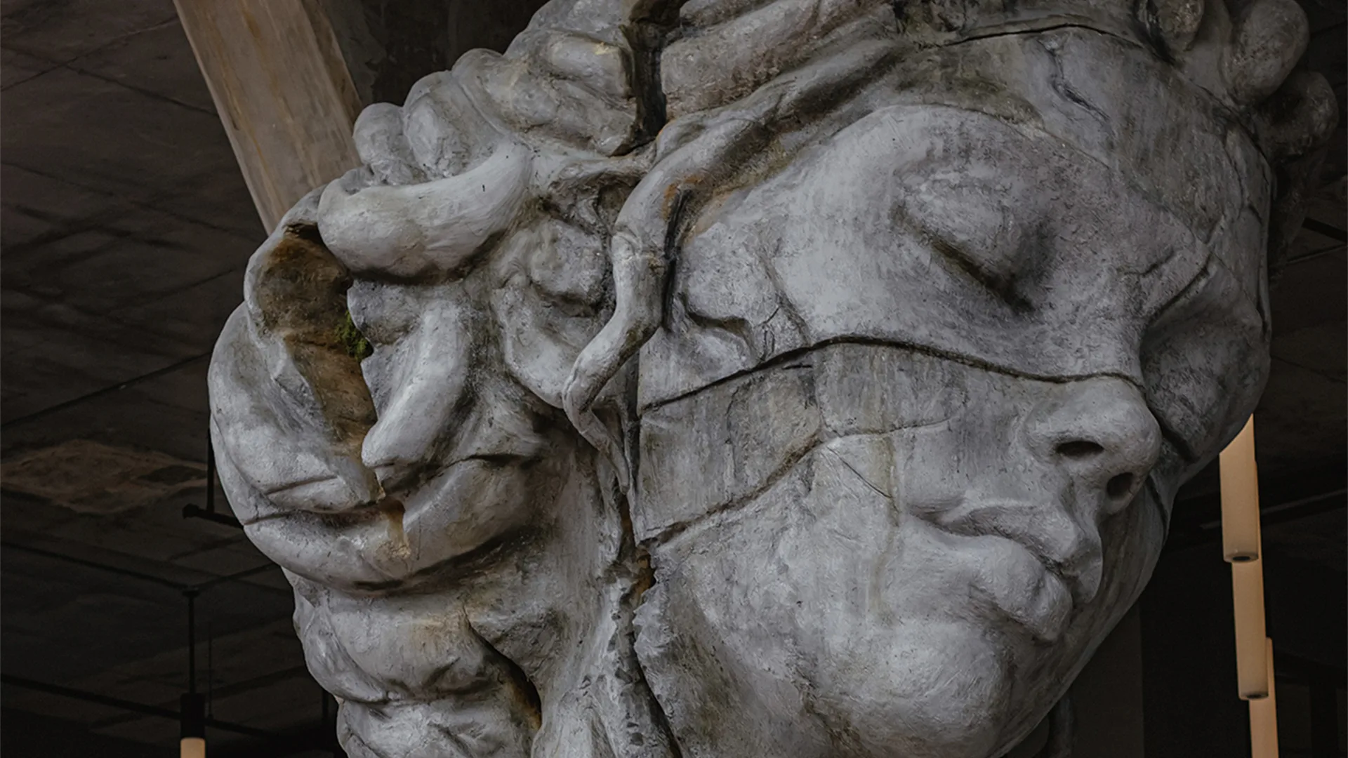 A cracked statue of a woman