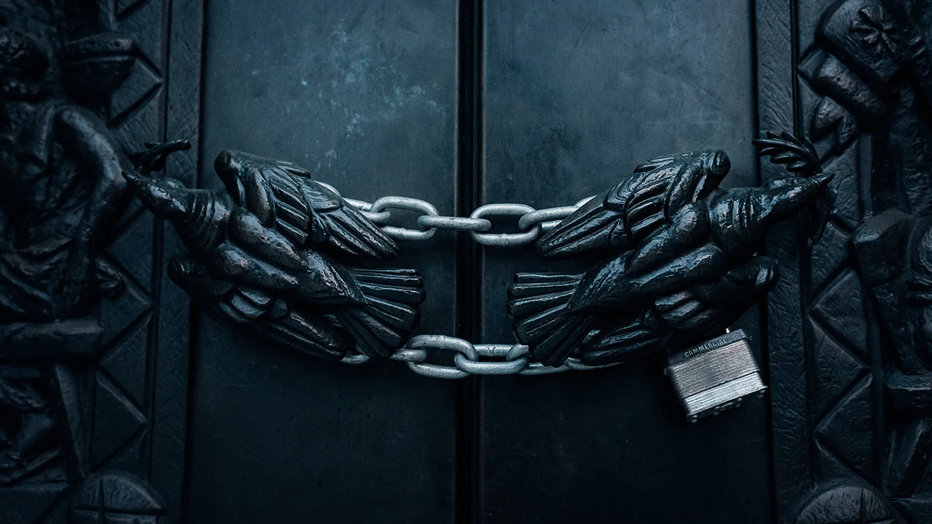 A door locked with a chain and padlock