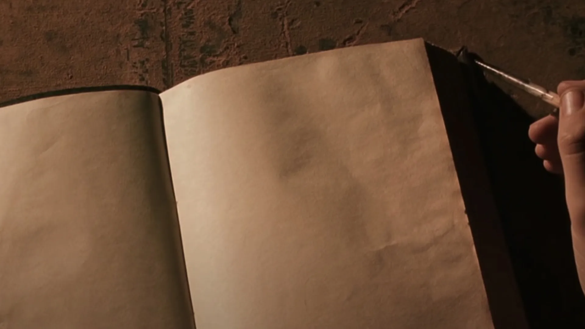 An empty notebook with a quill