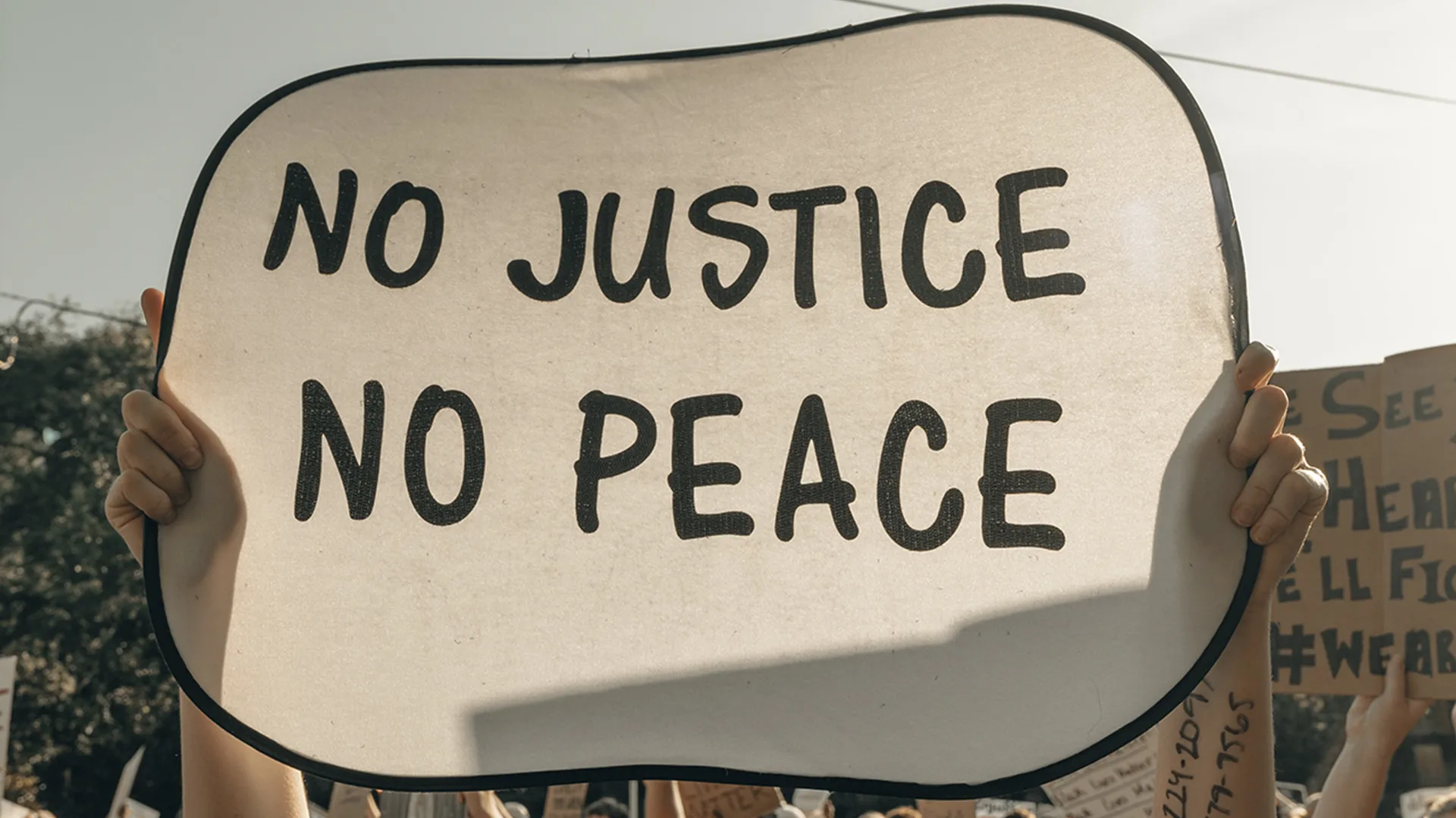 Person holding a protest sign