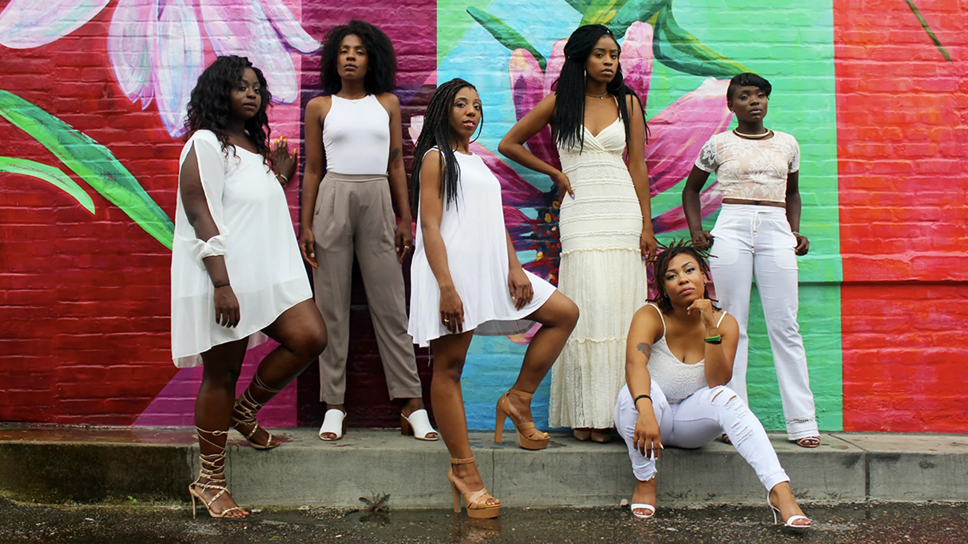 Women standing together looking strong