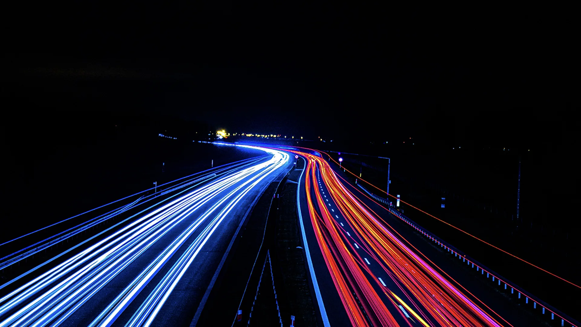 Cars driving fast down a motorway