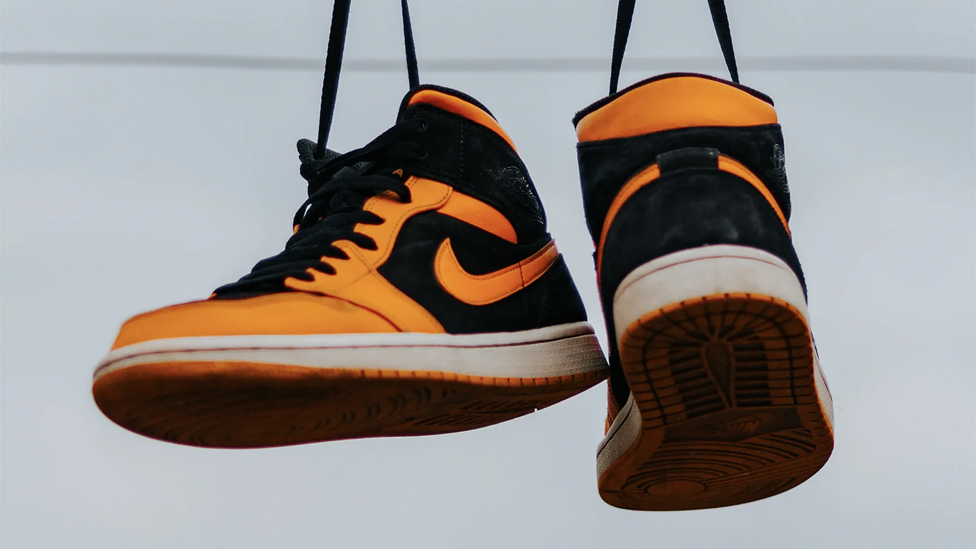 Air Jordans hanging on a wire