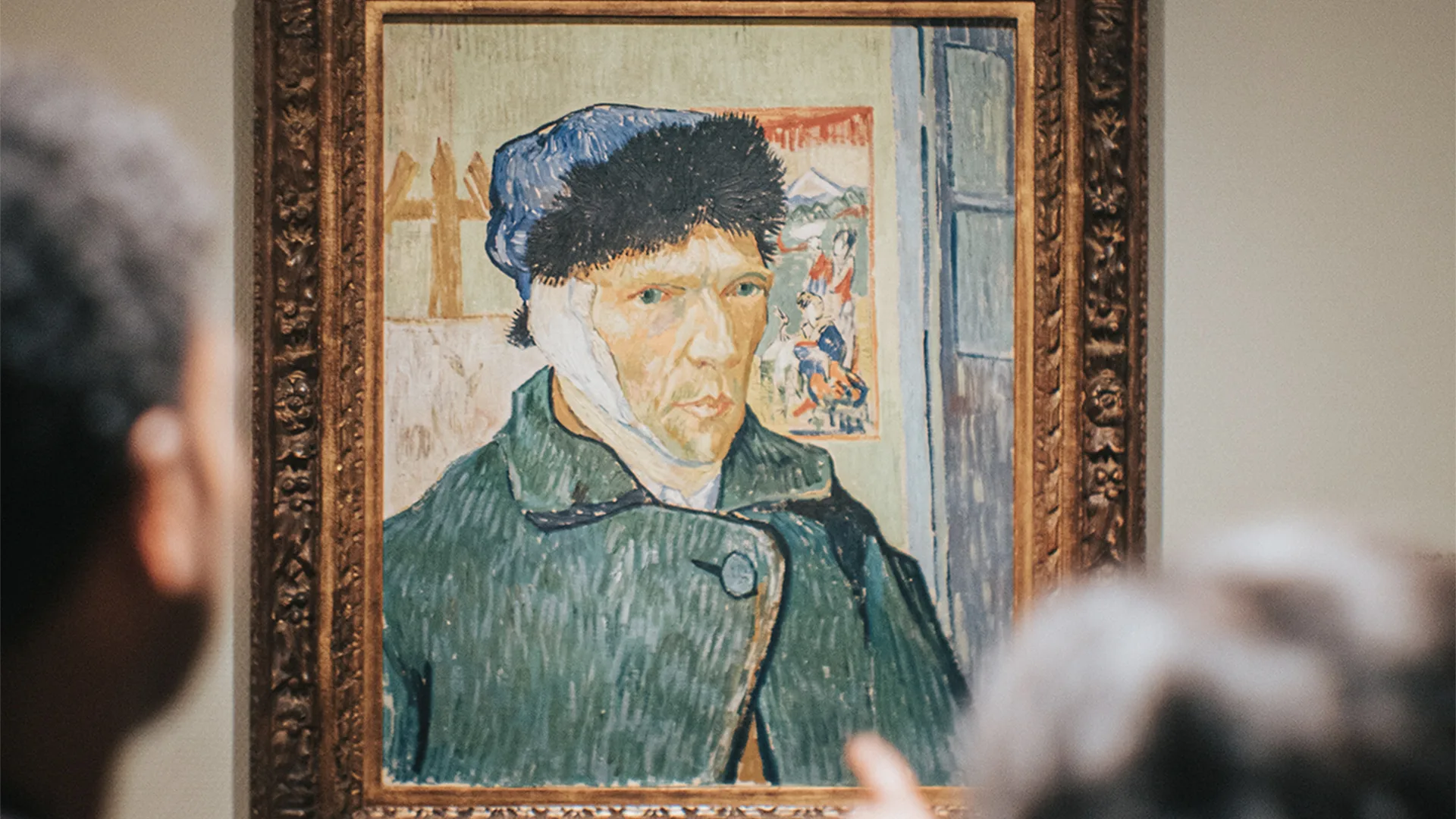 People looking at art work