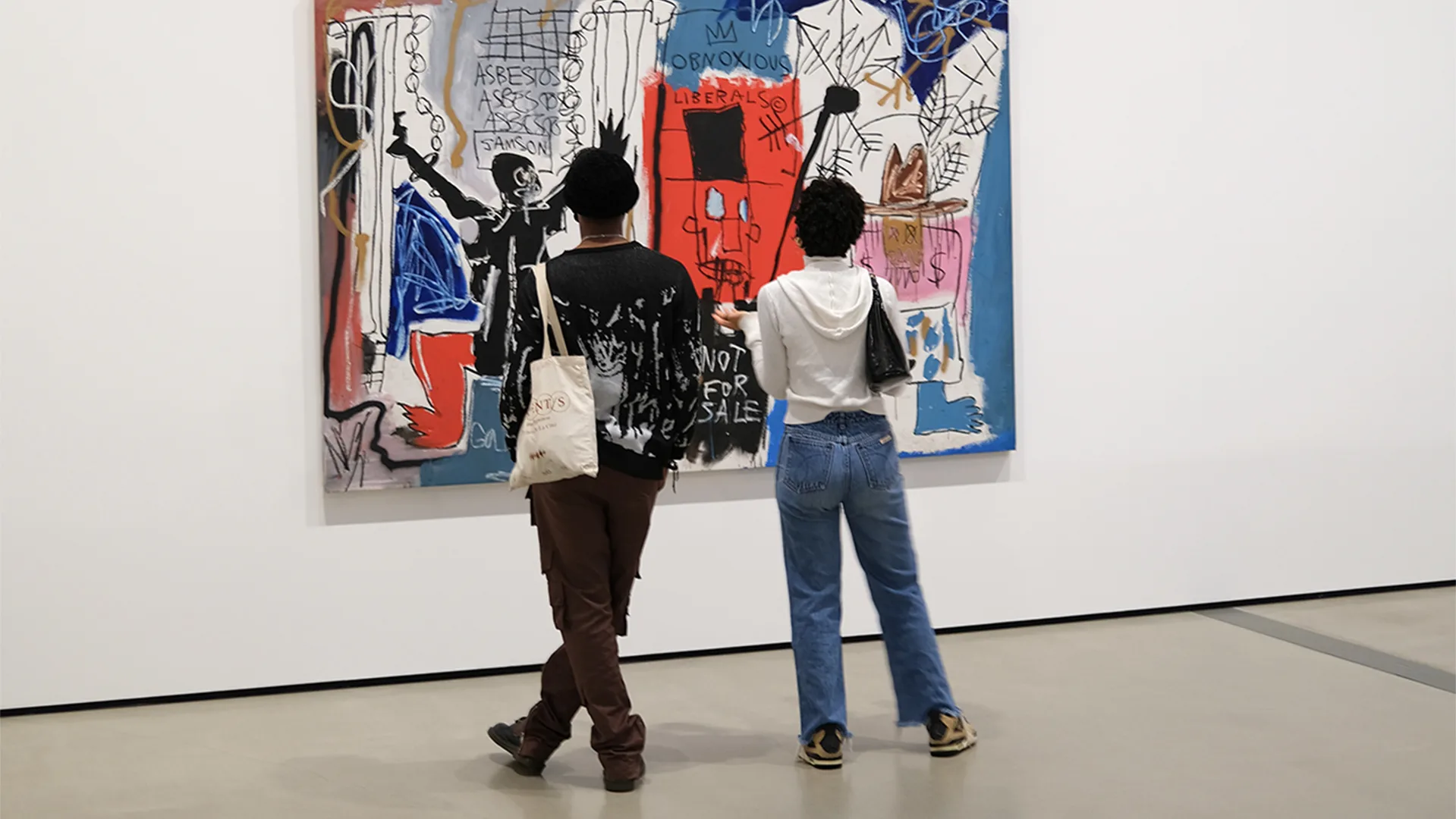 People looking at art work