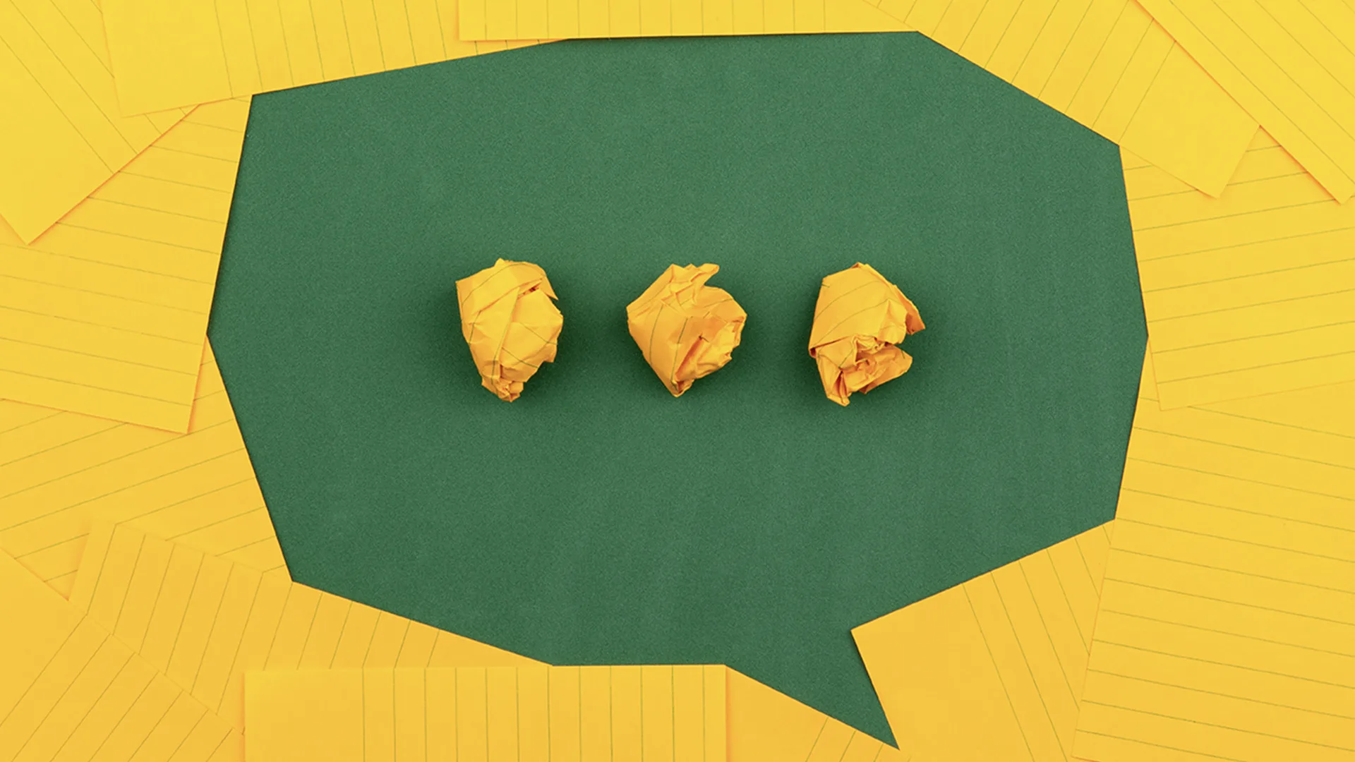 Yellow paper arranged as speech bubble