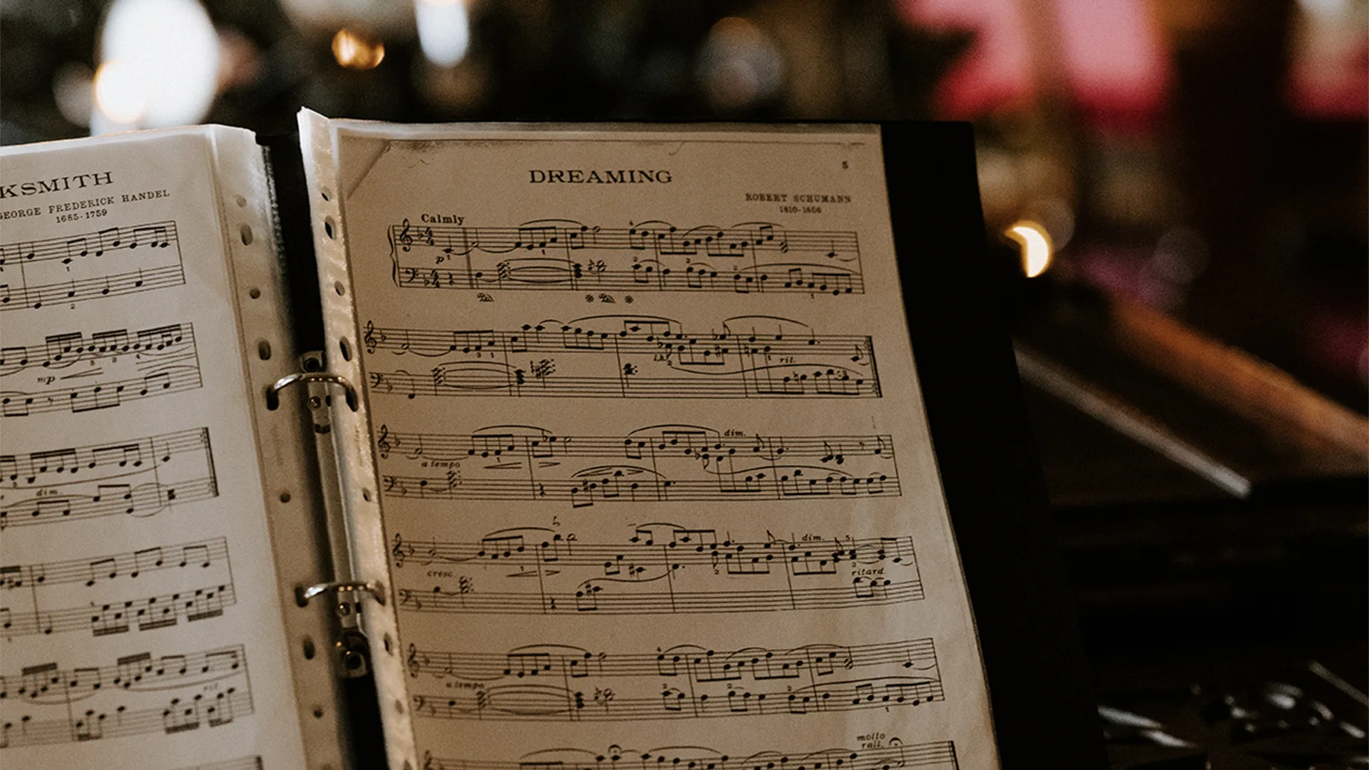 Christmas scene with someone holding a sheet of music