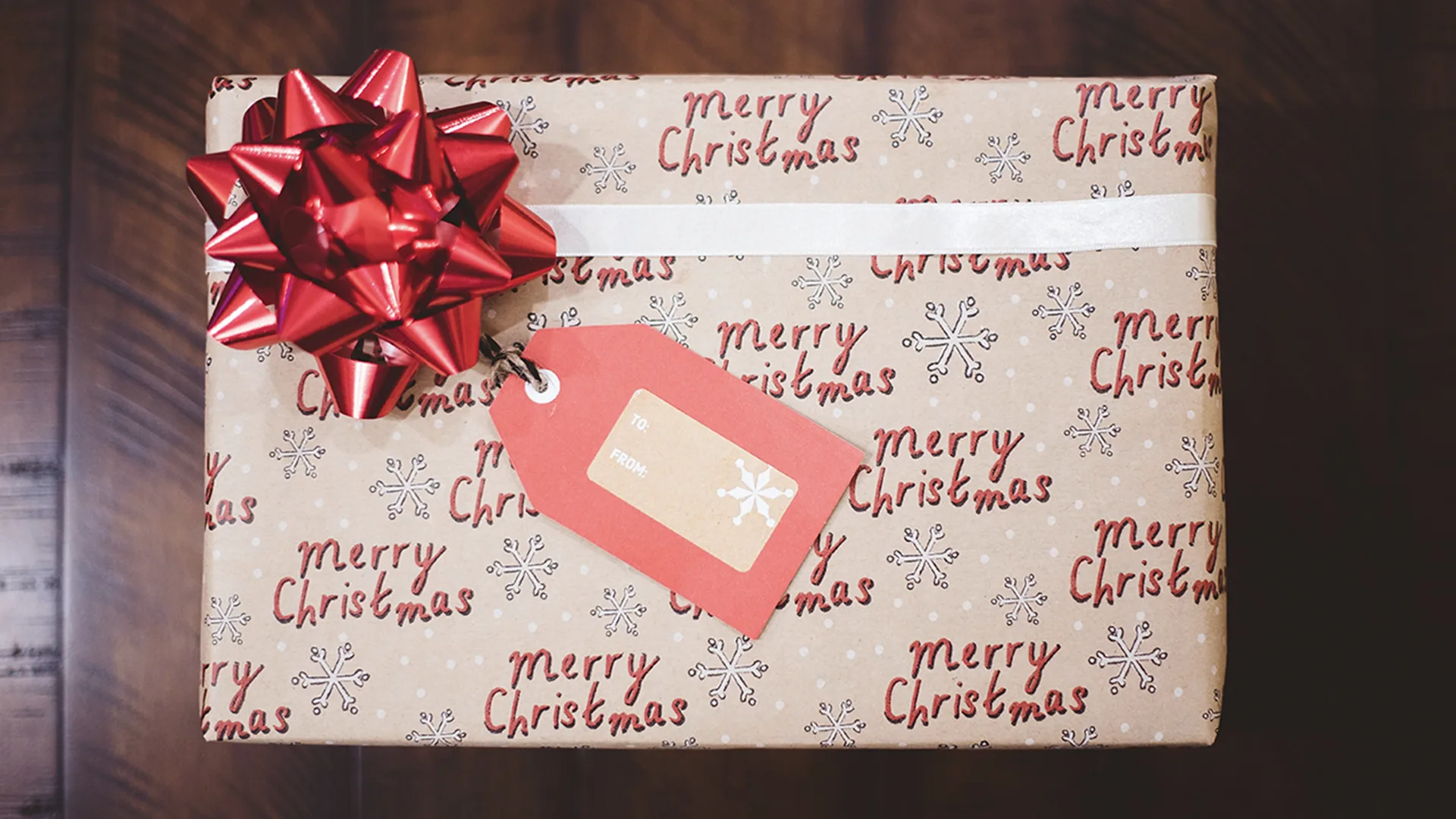 Christmas present wrapped with name tag on it