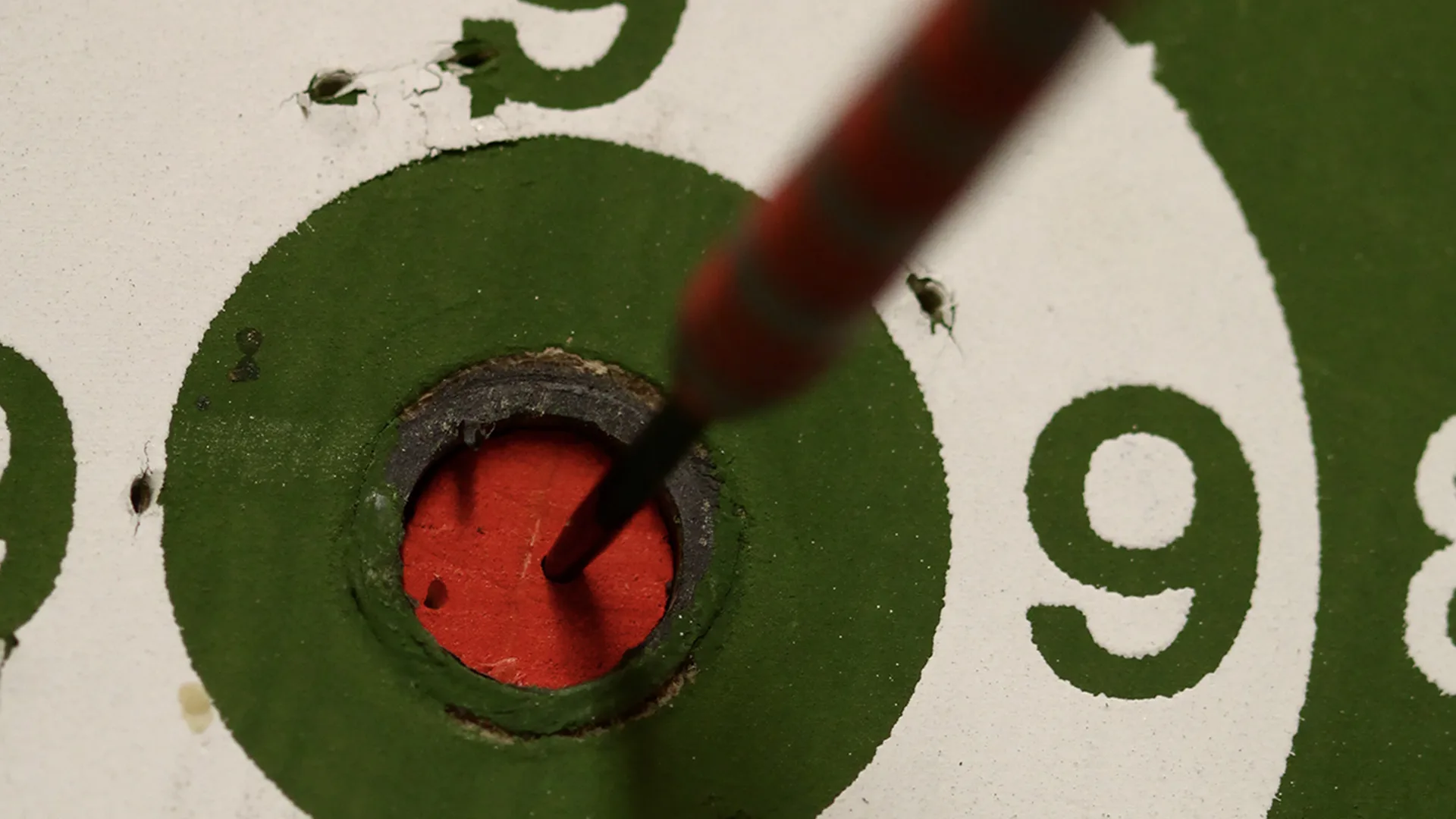 A dart hitting bullseye
