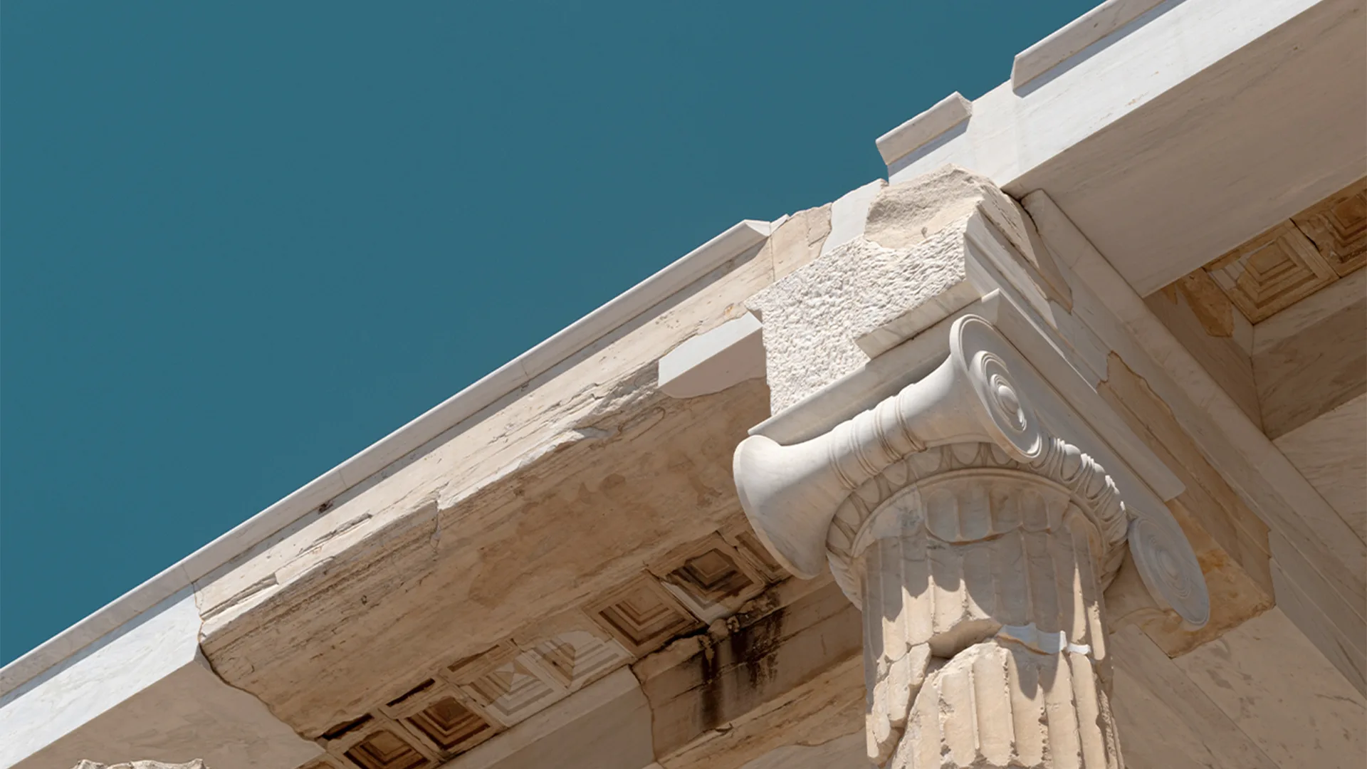 A close up of ancient columns on a building