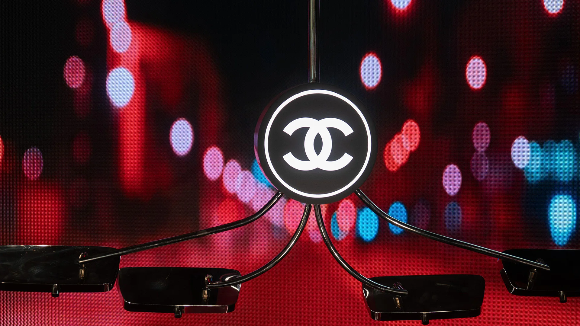 Chanel mobile with products hanging from it