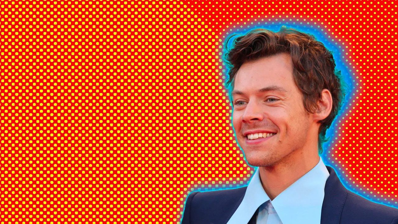 A photograph of Harry Styles smiling in a blue collared shirt against an orange dotted background with a blue halo