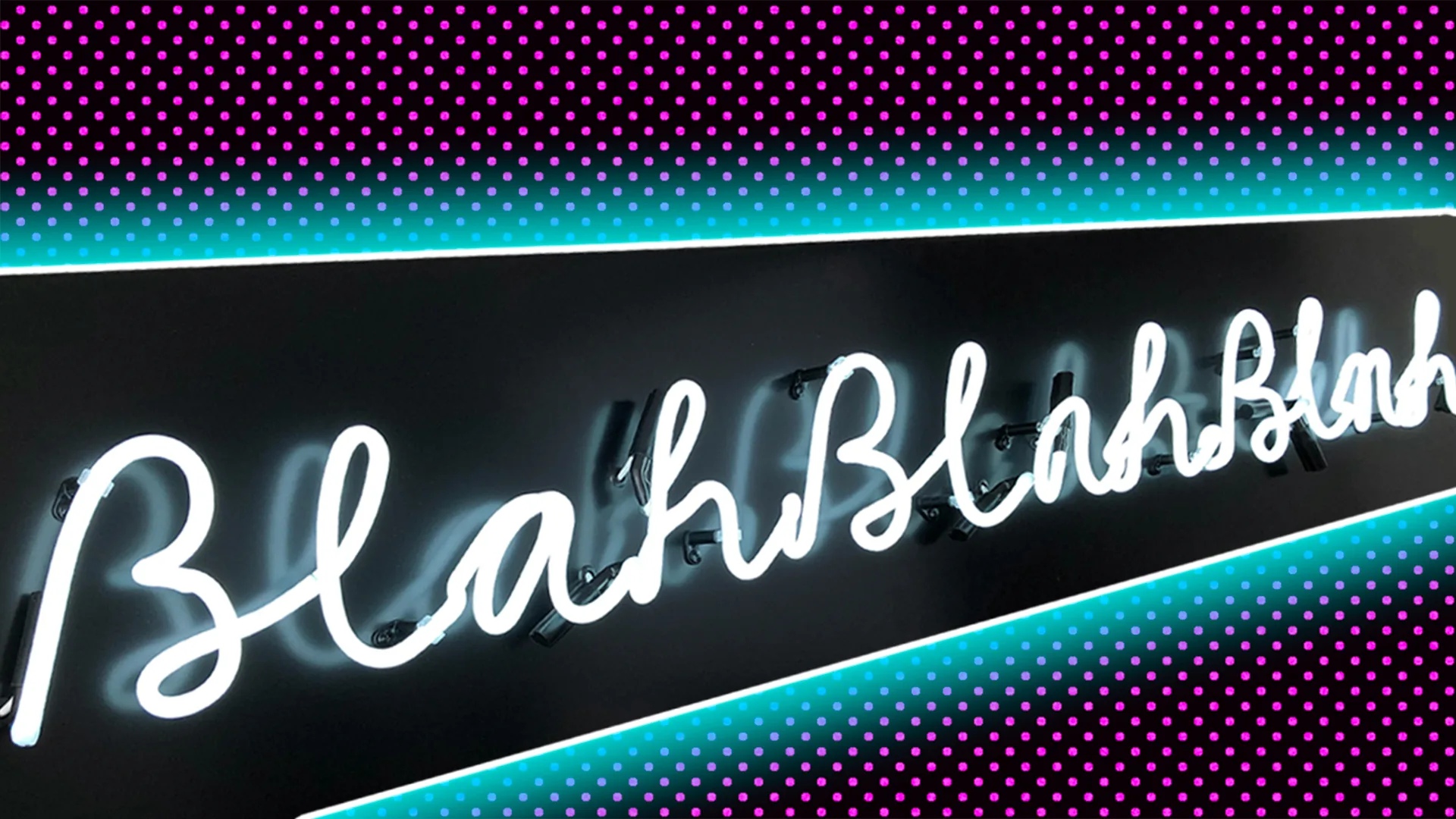 Glowing neon sign saying 'Blah Blah Blah' on a spotty purple background
