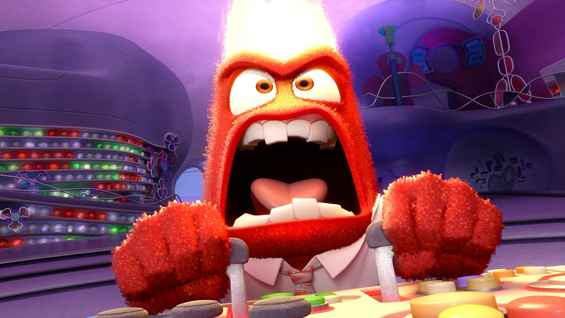 A close-up of Anger from Disney/Pixar Inside Out losing his temper at the control panel as fire comes out of his head.